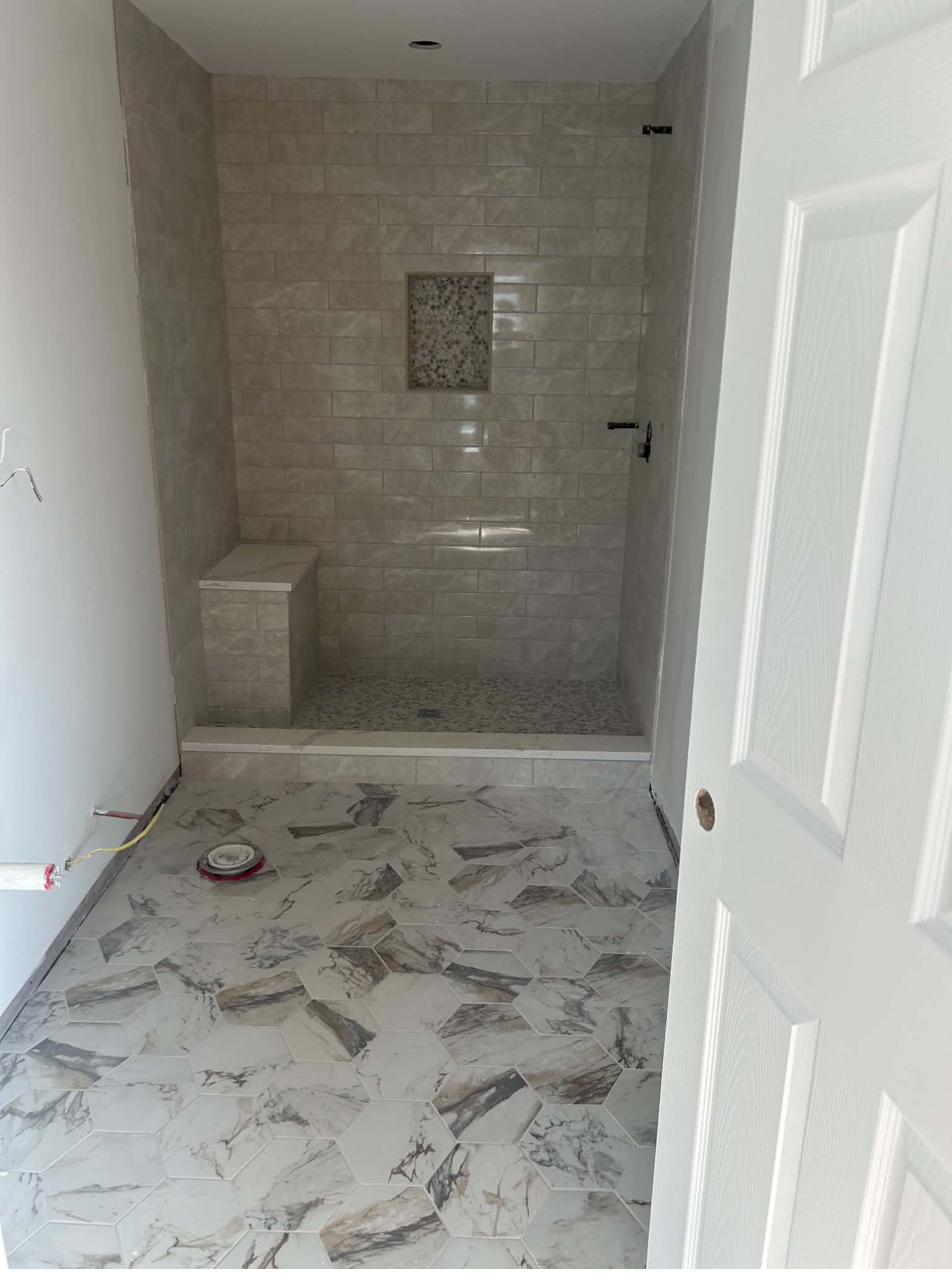 Contemporary bathroom remodel with marble tile floor and shower