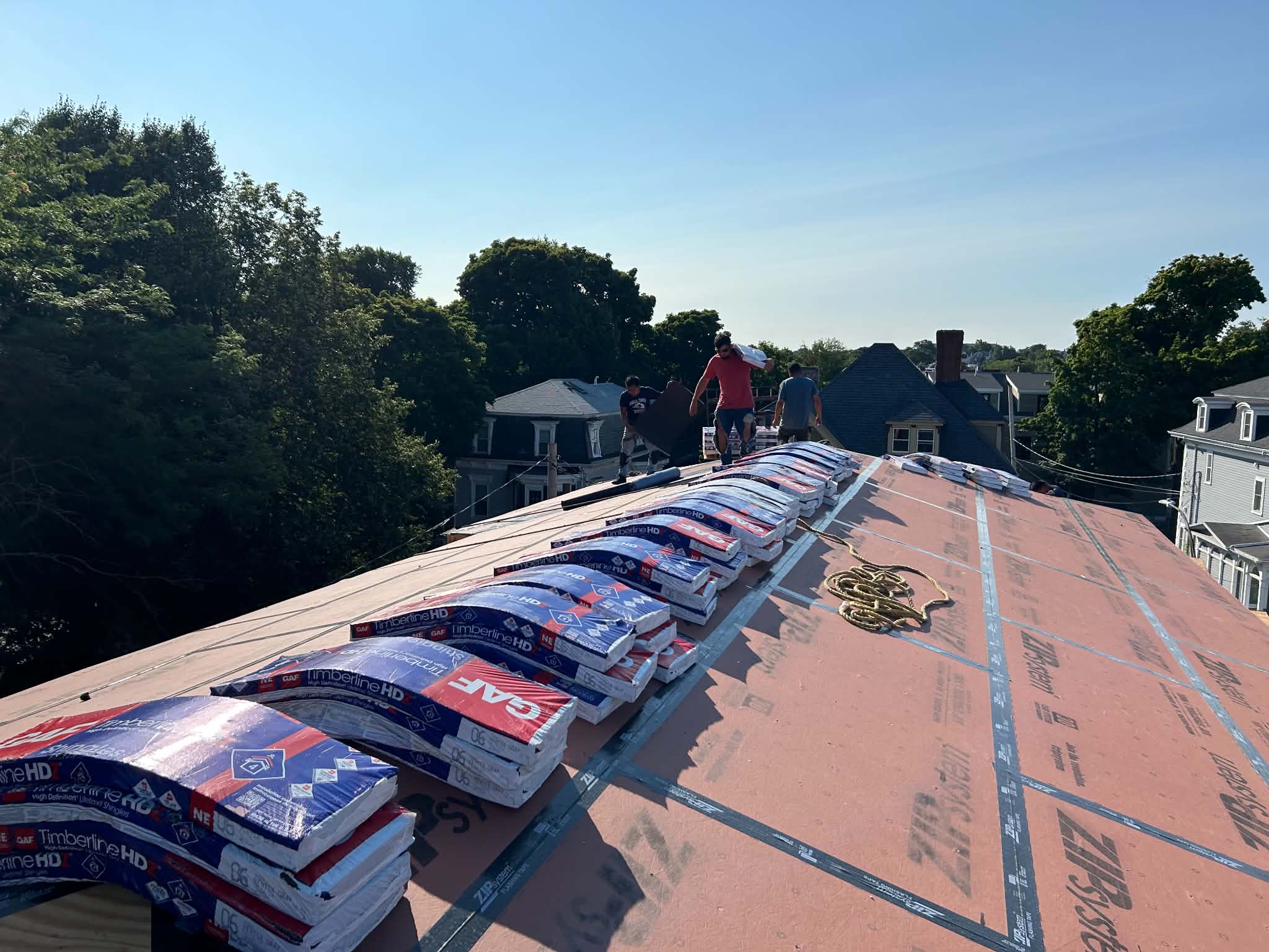 Roofing installation process with organized shingle stacks